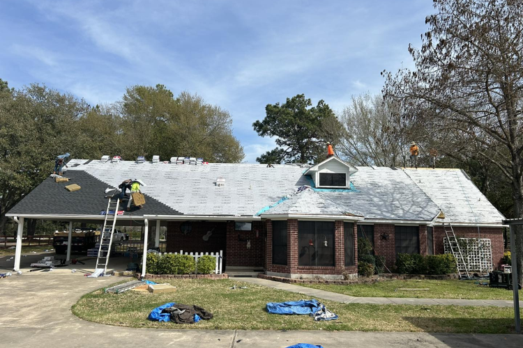 Total Roofing & Exteriors team working on a roof in the Northwest Houston area.