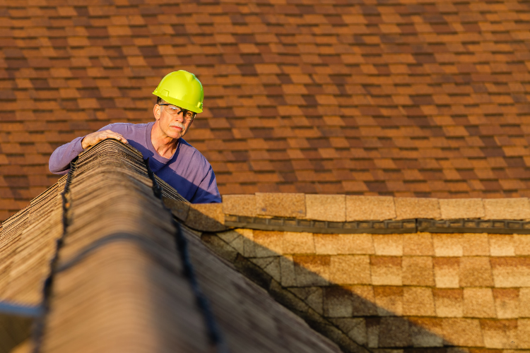 GAF Certified Roofing Contractor inspecting a roof in Magnolia