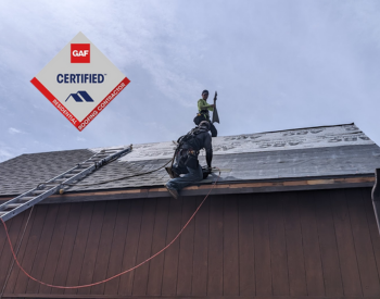 Total Roofing & Exteriors team installing energy-efficient roof with a GAF-certified roofing contractor-badge
